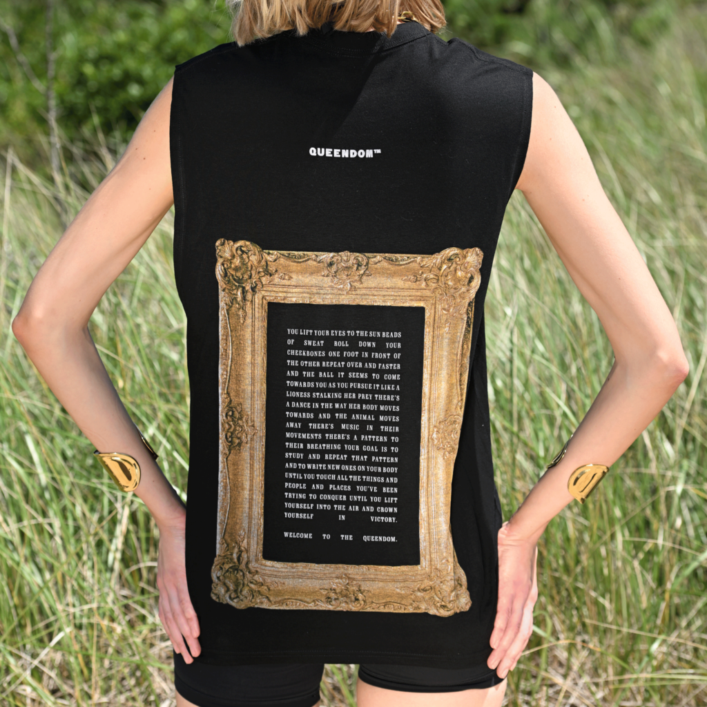Back view of woman wearing black Casa Malka sleeveless shirt with gold frame design