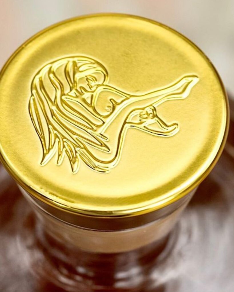 Close-up of the Casa Malka Tequila cork with gold detailing and intricate design